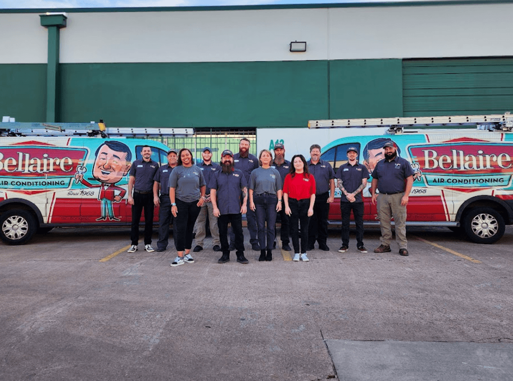 Team Bellaire Air Conditioning: Dedicated HVAC professionals posing confidently in front of our branded vehicles, ready to deliver top-notch heating and cooling services in Afton Oaks, TX. Trust us for reliable expertise and exceptional customer service, including AC repair near me.