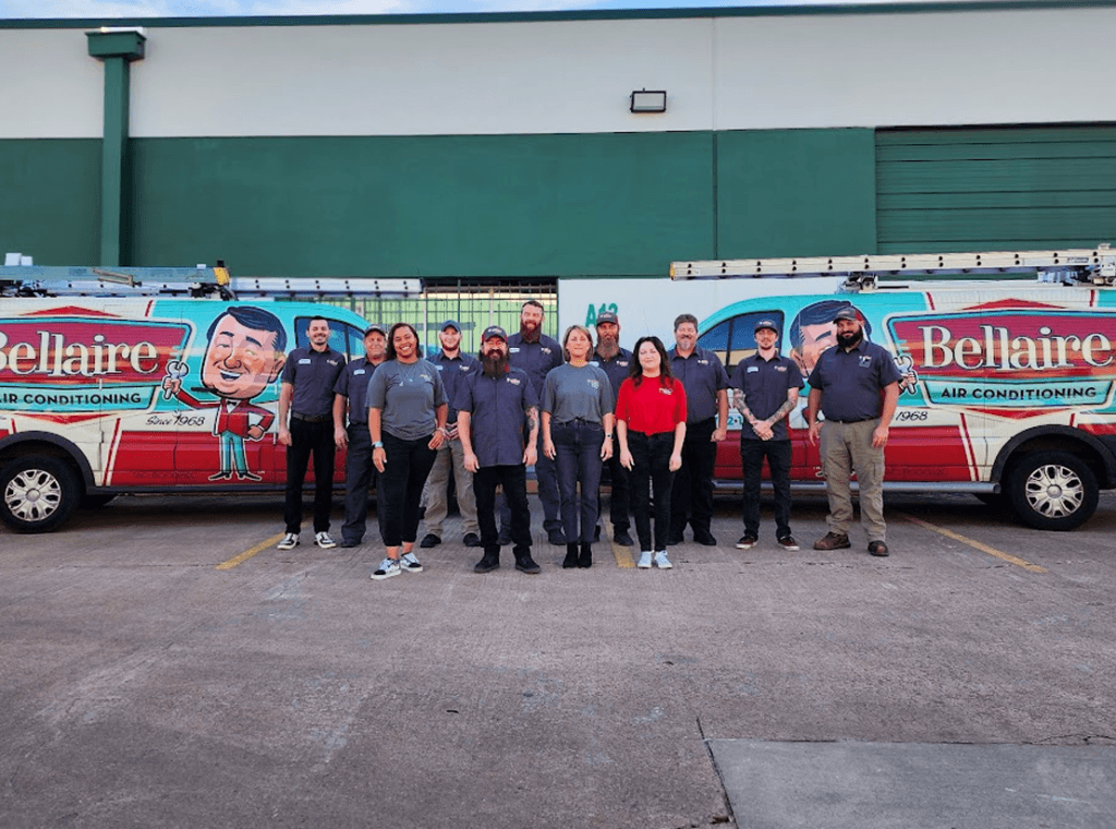 Team Bellaire Air Conditioning: Dedicated HVAC professionals posing confidently in front of our branded vehicles, ready to deliver top-notch heating and cooling services in Braeswood Place, TX. Trust us for reliable expertise and exceptional customer service, including AC repair near me.